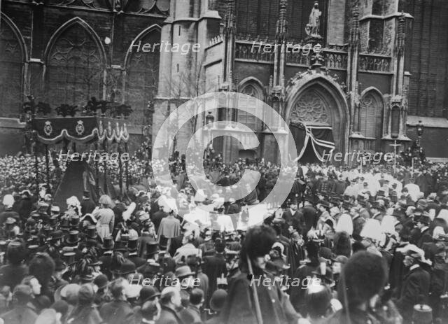 Crowd outside church allowing funeral cortege of King Leopold to pass, Belgium, 1910. Creator: Bain News Service.
