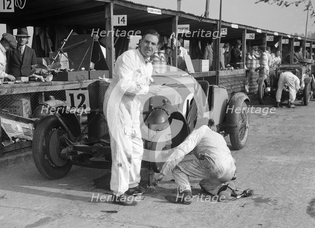 Mechanic working on a Talbot 105 at the JCC Double Twelve race, Brooklands, 8/9 May 1931. Artist: Bill Brunell.
