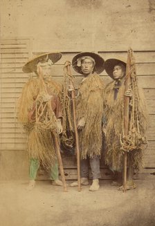 Three Japanese men in grass robes and wide-brimmed hats, 1868-1880. Creator: Felice Beato.