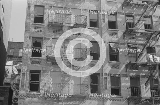 House fronts, 61st Street between 1st and 3rd Avenues, New York, 1938. Creator: Walker Evans.