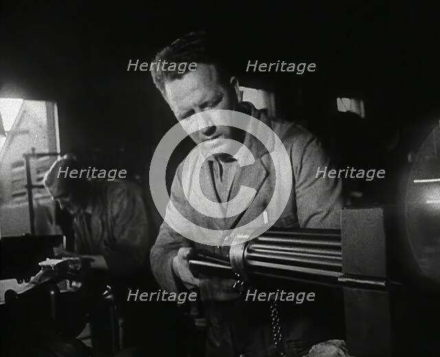 British Factory Workers Making a Machine Gun, 1941. Creator: British Pathe Ltd.