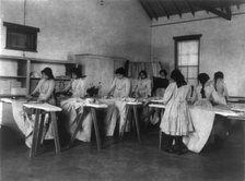 Carlisle Indian School, Carlisle, Pa. Ironing class, 1901. Creator: Frances Benjamin Johnston.