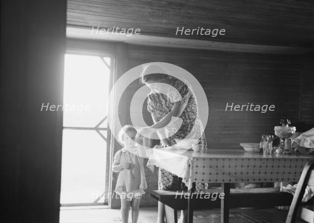 Wife and child of tobacco sharecropper, Person County, North Carolina, 1939. Creator: Dorothea Lange.