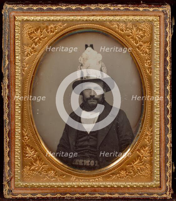 Portrait of a Seated Bearded Man Wearing a Tall, Decorative Helmet, about 1854. Creator: George D. Hamilton.