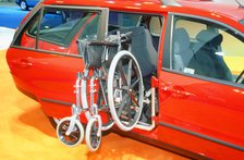 Wheelchair access into car. Artist: Unknown.