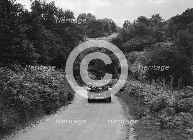Car taking part in a First Aid Nursing Yeomanry trial or rally, 1931. Artist: Bill Brunell.