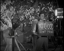 Female Actor Sitting in a Blossom Tree Whilst a Male Civilian Talks to Her..., 1920s. Creator: British Pathe Ltd.