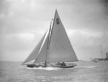 The 8 Metre class 'Kathleen' (H10) sailing upwind in a good breeze, 1911. Creator: Kirk & Sons of Cowes.