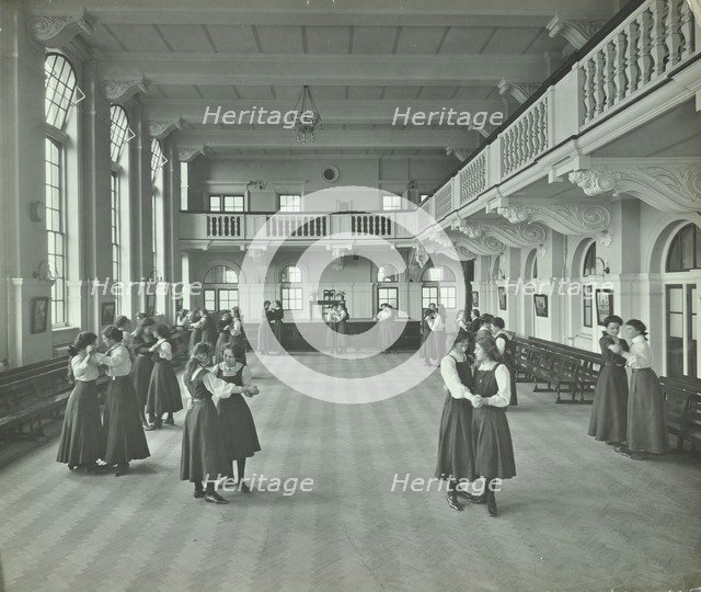 Girls dancing in the assembly hall, Clapham Secondary School, London, 1910. Artist: Unknown.