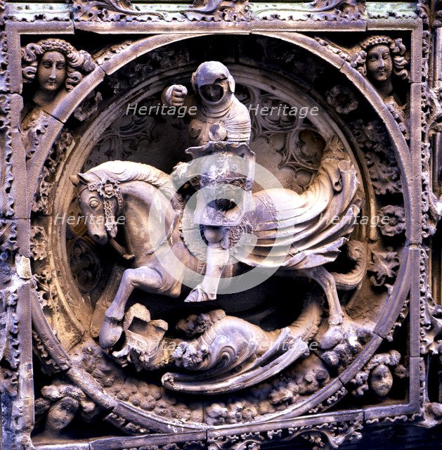 Sant Jordi medallion at the entrance of the Gothic façade of the Palace of the Generalitat of Cat…