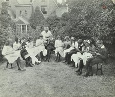 Pupils in the garden doing needlework, Birley House Open Air School, Forest Hill, London, 1908. Artist: Unknown.
