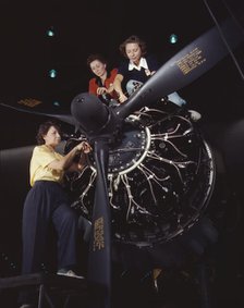 Women at work on C-47 Douglas cargo transport, Douglas Aircraft Company, Long Beach, Calif., 1942. Creator: Alfred T Palmer.