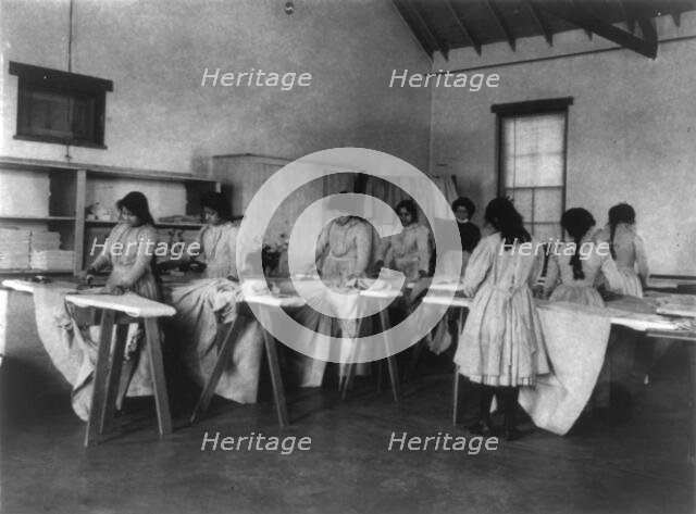 Carlisle Indian School, Carlisle, Pa. Ironing class, 1901. Creator: Frances Benjamin Johnston.