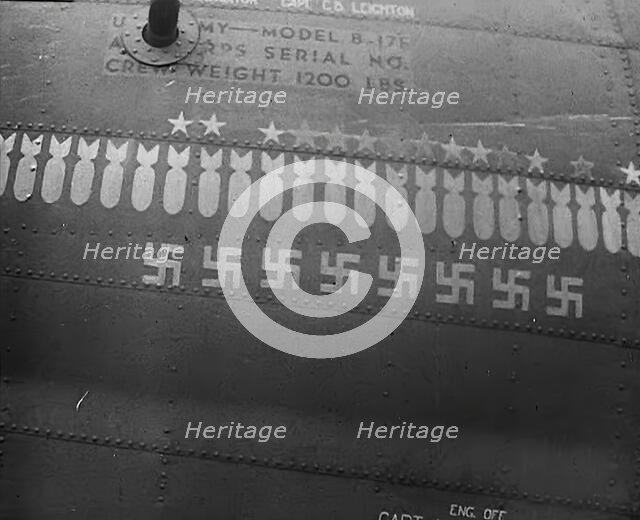 Swastika and Bomb Images Painted on the Fuselage of a Bomber Aircraft, 1943-1944. Creator: British Pathe Ltd.