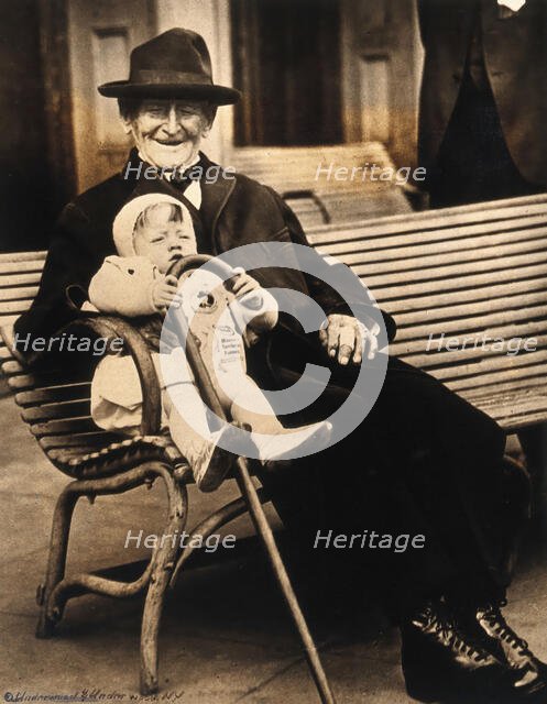 John Daubeny, a centenarian, holding a 1 year old boy, c1922. Creator: Unknown.