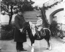 Quentin Roosevelt instructed in horsemanship at the White House, c1902 June 17. Creator: Frances Benjamin Johnston.