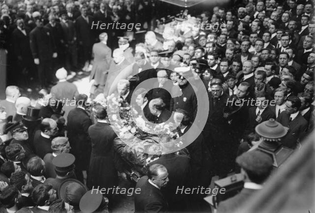 Tim Sullivan's coffin brought out, 1913. Creator: Bain News Service.