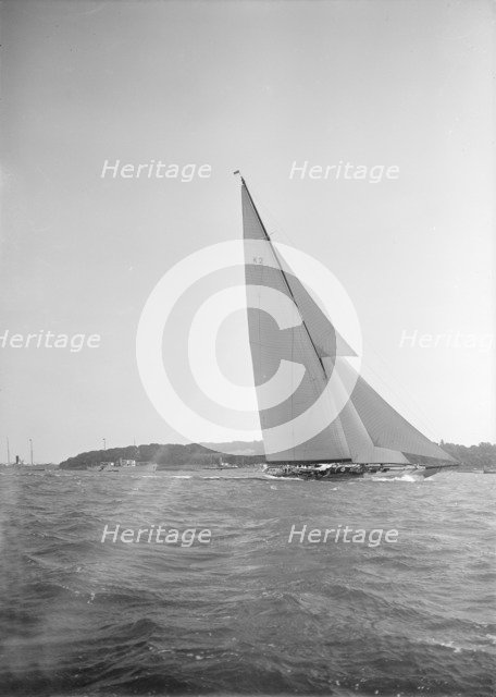 The 23-metre cutter 'Astra' sailing close-hauled, 1934. Creator: Kirk & Sons of Cowes.