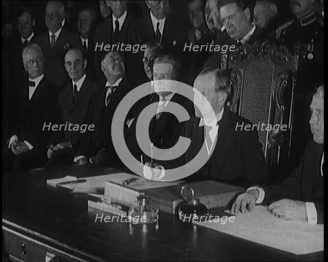 Frank Billings Kellogg Sitting Next to American President Calvin Coolidge Signing the Kellogg...1929 Creator: British Pathe Ltd.