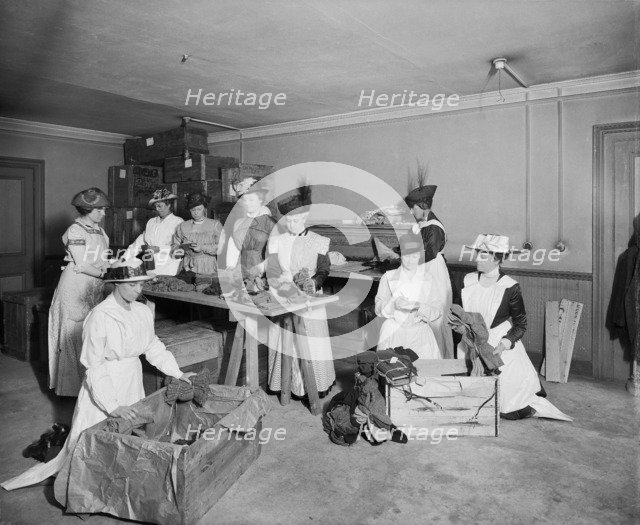Packing socks for the troops, Westminster Palace Hotel, Westminster, London, 1915. Artist: H Bedford Lemere.