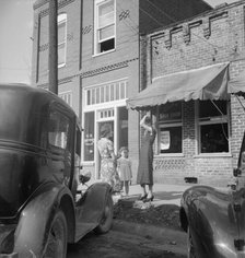 Street encounter on a Saturday afternoon, Pittsboro, North Carolina, 1939. Creator: Dorothea Lange.