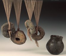 Clay loomweights and pot. Artist: Unknown