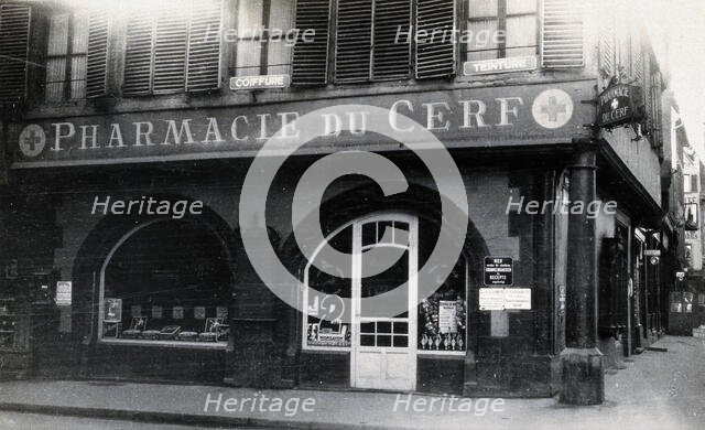 The front door of the Pharmacie du Cerf on the corner of the street, Strasbourg, c1900s.. Creator: Unknown.