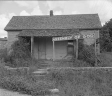 Migrants carry this sect to California, Northern Arkansas on U.S. 62, 1938. Creator: Dorothea Lange.