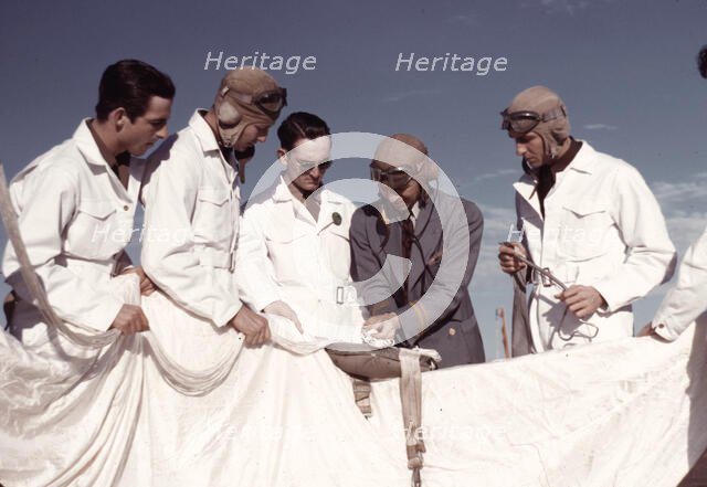Instructor explaining the operation of a parachute to student pilots, Fort Worth, Tex., 1942. Creator: Arthur Rothstein.