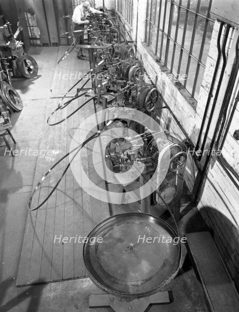 Continuous sharpening of longsaw blades, Slack Sellars & Co, Sheffield, South Yorkshire, 1963.  Artist: Michael Walters