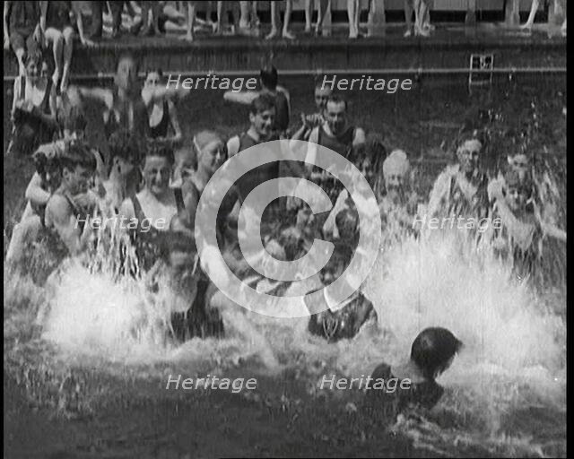 British People Splashing and Playing in the Chiswick Open Air Baths, 1920. Creator: British Pathe Ltd.
