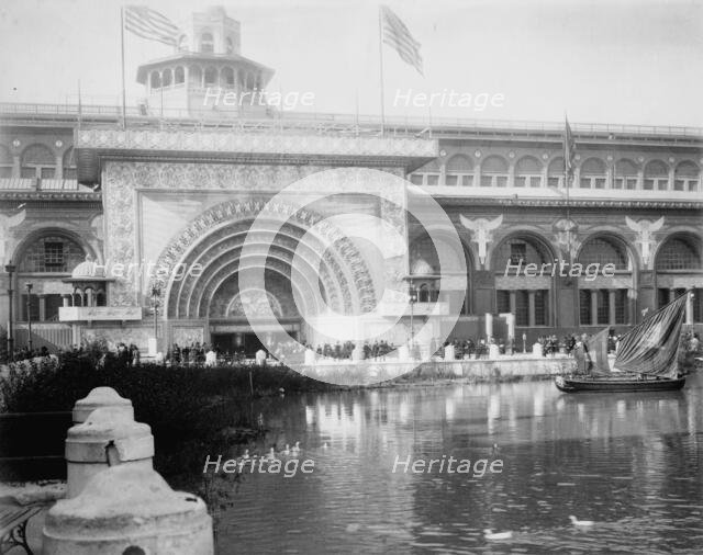 Transportation exhibit building with canal boat and ducks on canal(?) in foreground..., 1893. Creator: Frances Benjamin Johnston.