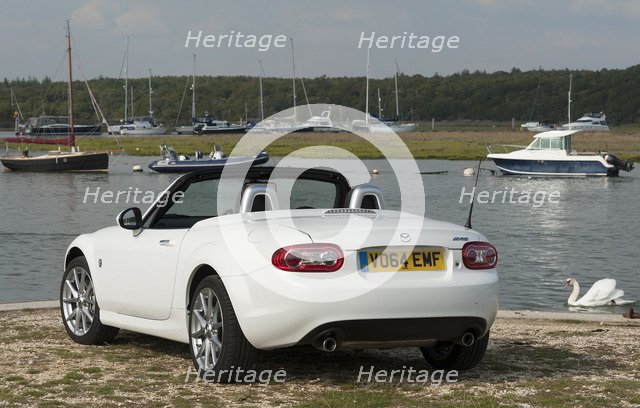 2014 Mazda MX5 Roadster Coupe Artist: Unknown.