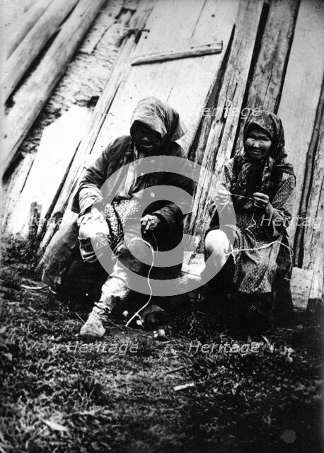 Tutur Tungus. Dudovka camp. Old women twist threads from deer tendons, 1920-1939. Creator: Unknown.