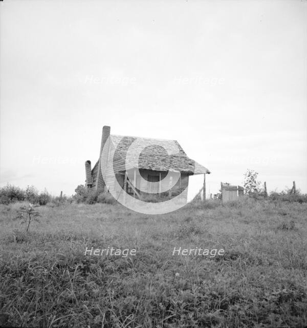Many cabins of this type are found on the Mississippi Delta, 1936. Creator: Dorothea Lange.