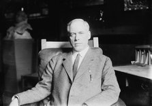 Prof. Jeremiah W. Jenks seated in study, 1912. Creator: Bain News Service.