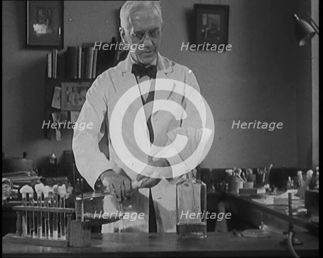 Dr Alexander Fleming, the Inventor of Penicillin, Experimenting in a Laboratory, 1929. Creator: British Pathe Ltd.