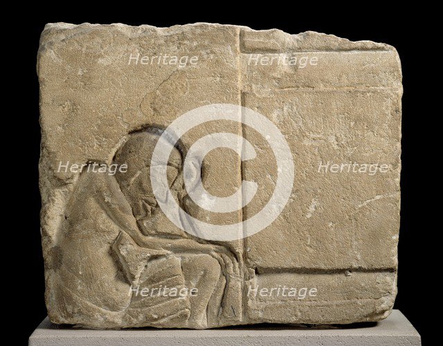 Limestone fragment carved relief of sleepy servant, XVIIIth Dynasty, c1540-c1292BC. Artist: Unknown.