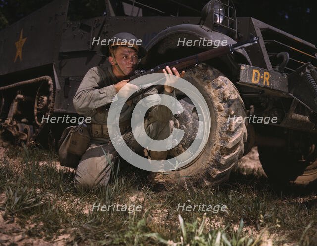 Infantryman with halftrack, a young soldier of the armed forces, holds..., Fort Knox, Ky., 1942. Creator: Alfred T Palmer.