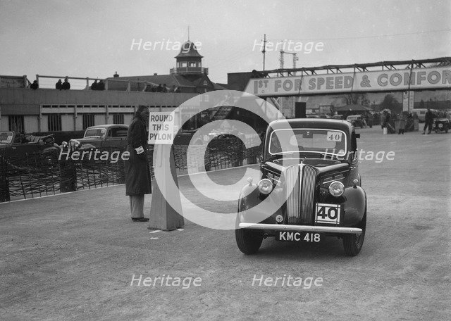 Standard saloon competing in the JCC Rally, Brooklands, Surrey, 1939. Artist: Bill Brunell.