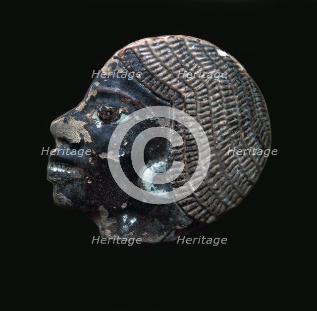 Egyptian glazed relief of a black slave. Artist: Unknown