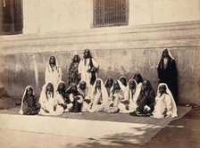 Kashmiri women in traditional dress: group portrait, c1900. Creator: Unknown.