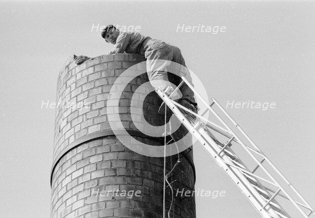 steeplejack up a 6 metre high chimney, Landskrona, Sweden, 1967. Artist: Unknown
