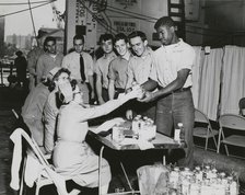 Crew members of the USS Lake Champlain (CVA-39) participating in the ship's two day..., 1950s.  Creator: United States Navy.