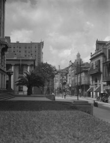 At the corner of Royal and Conti streets, New Orleans, between 1920 and 1926. Creator: Arnold Genthe.