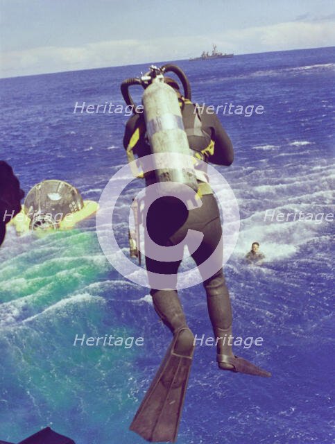 Navy diver leaps from helicopter, 1965. Creator: NASA.