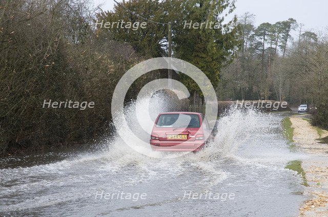 Rover Metro driving through floods at Beaulieu 2008. Artist: Unknown.
