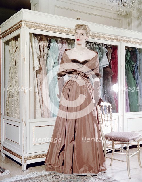 Female model shows an evening dress, Stockholm, 1950s. Artist: Göran Algård
