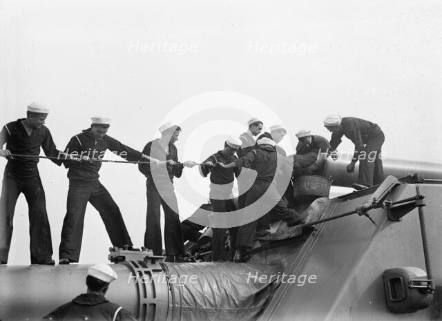 Target Practice - Cleaning 12' Gun, 1913. Creator: Unknown.
