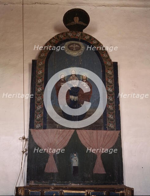 An altar in the church dedicated to the Trinity, Trampas, N.M., 1943. Creator: John Collier.